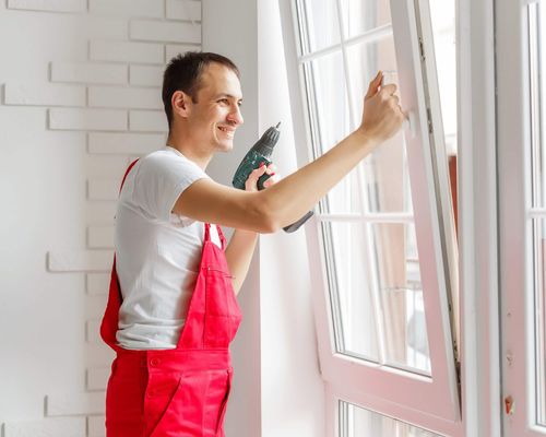 worker installing replacement window